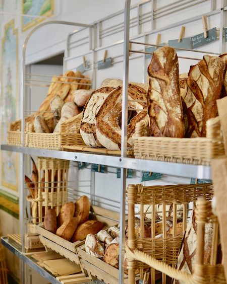 baskets of french bread in a boulangerie