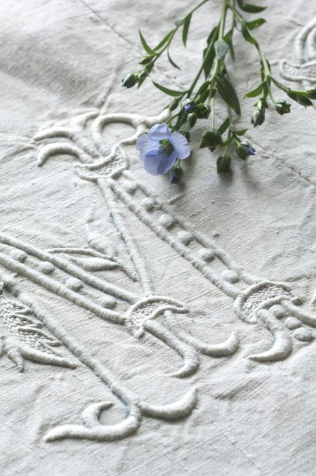 an antique linen embroidered with an 'M'