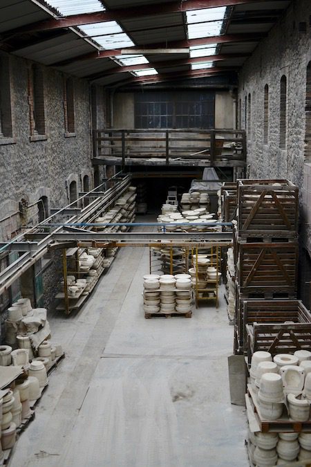 the interior of an old factory, ceramics lining the walls