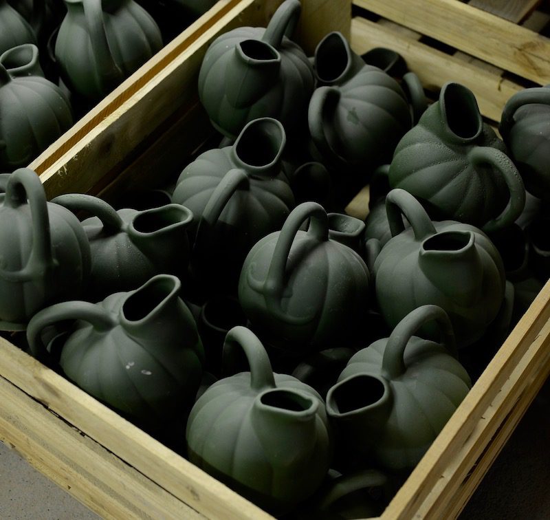 a crate of sculpted jugs from manufacture de digoin.