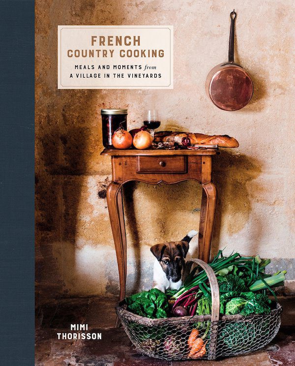 cookbook cover with image of end table and basket of lettuce
