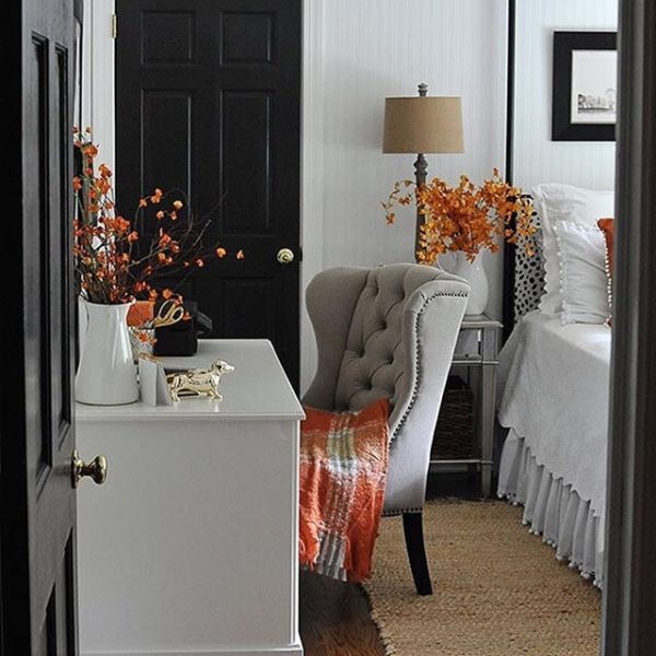 country style bedroom decorated in grey and orange tones
