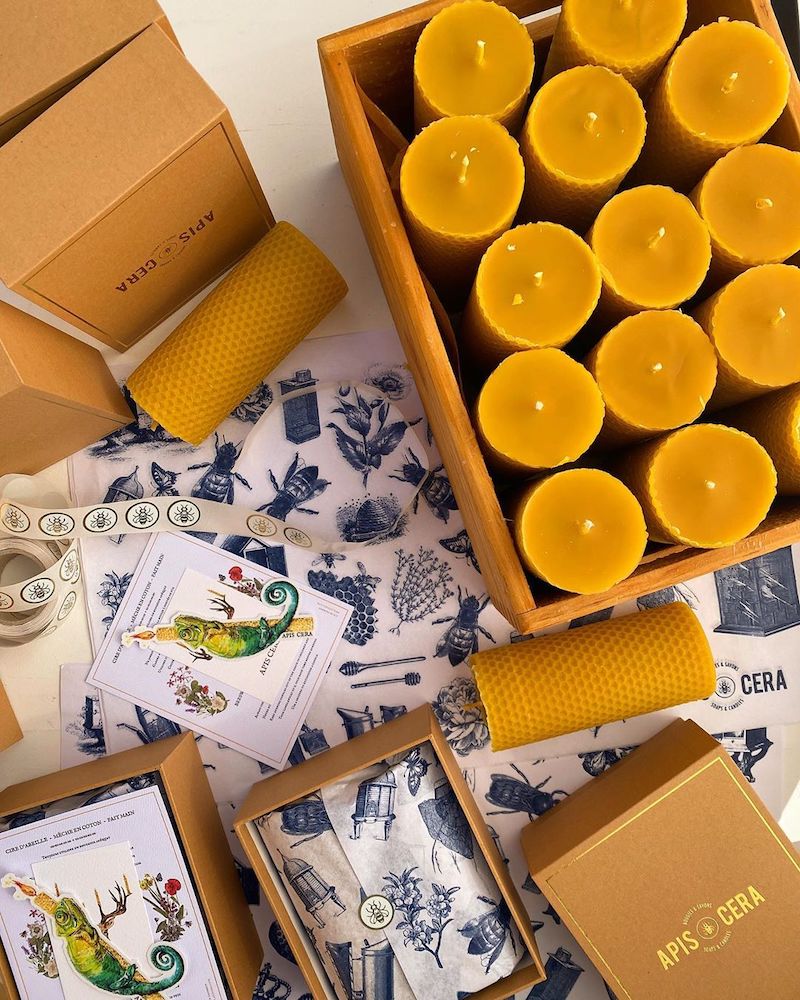 an overhead shot of a box of candles and toile de jouy wrapping paper