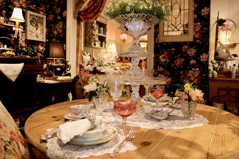 a table dressed with glasses and fine china