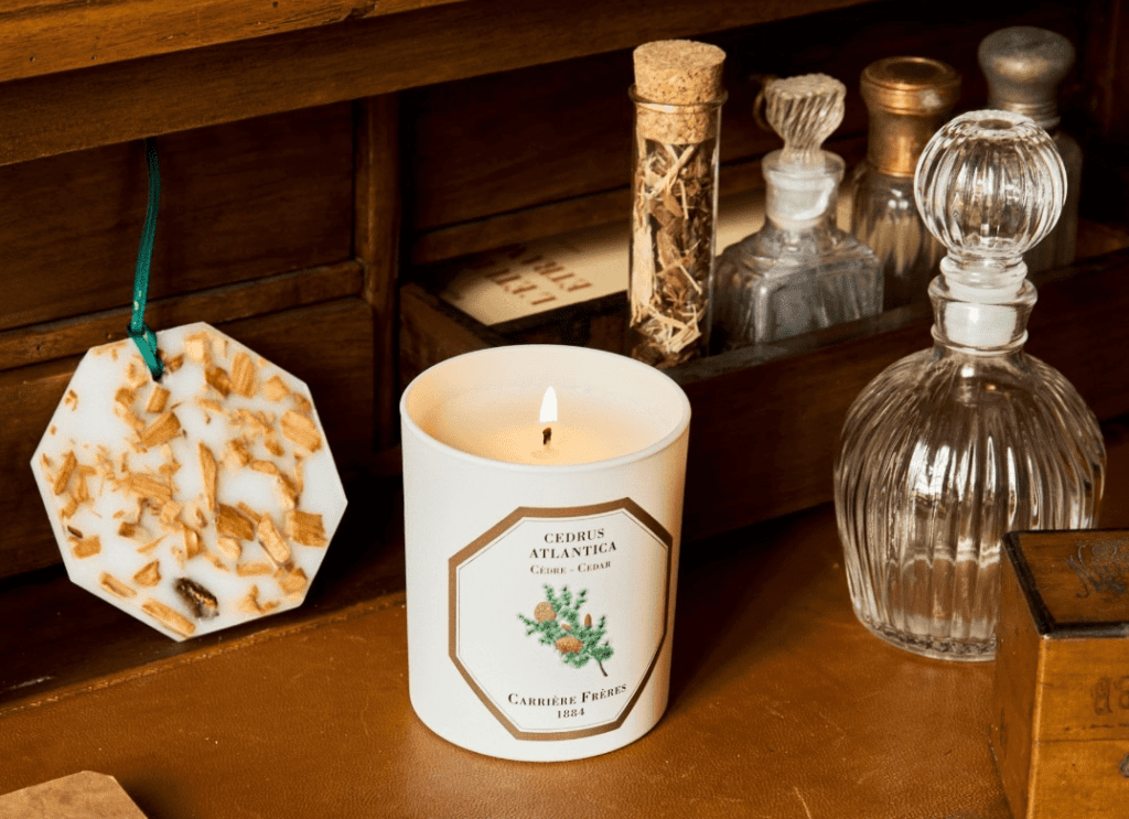 a candle burning on a desk