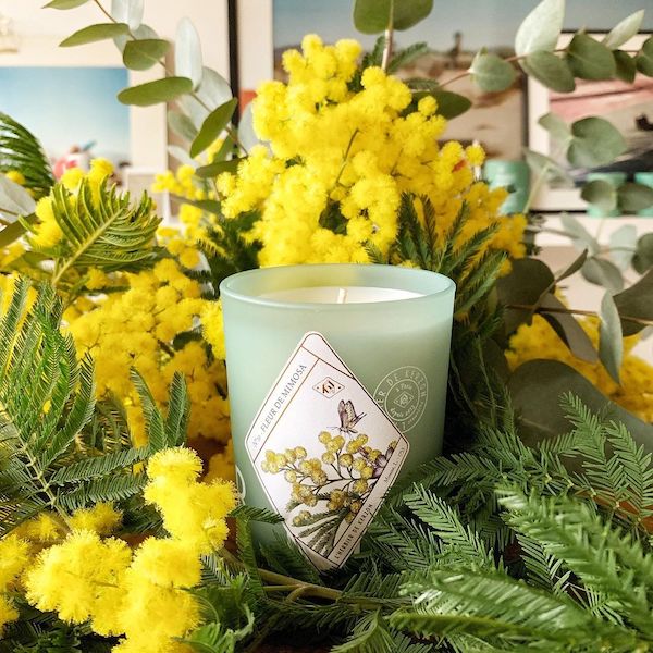 green candle with yellow flowers