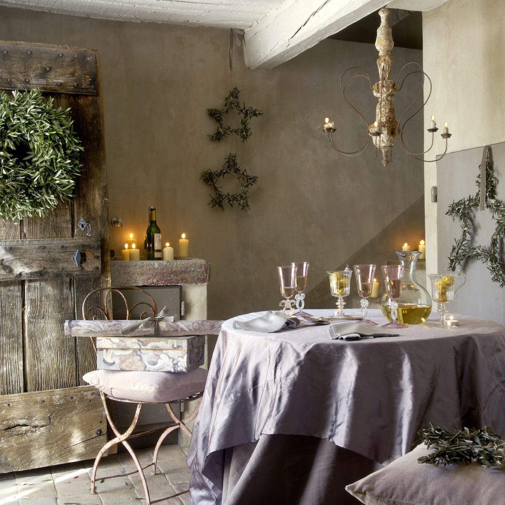 room with natural wreaths and star decor and purple tablescape