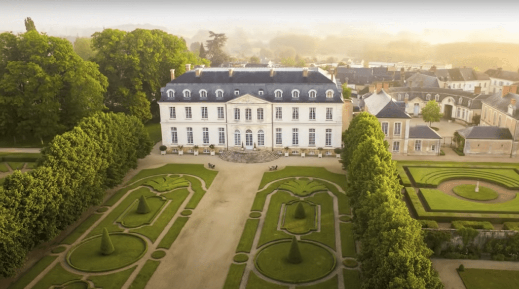 view of grand French chateau and gardens