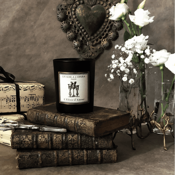 candle and flowers and books