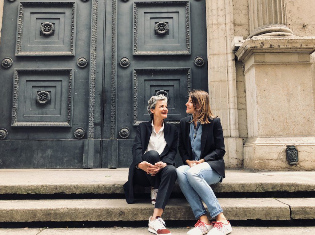 mother and daughter sitting