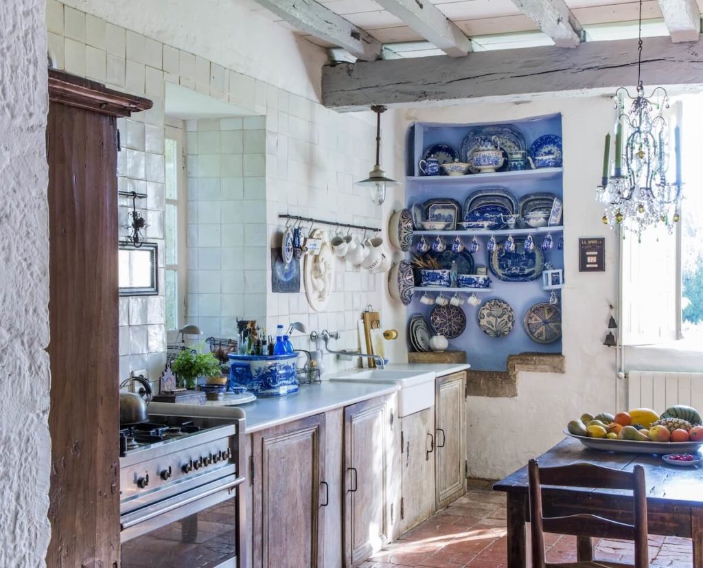 a kitchen with blue and white crockery