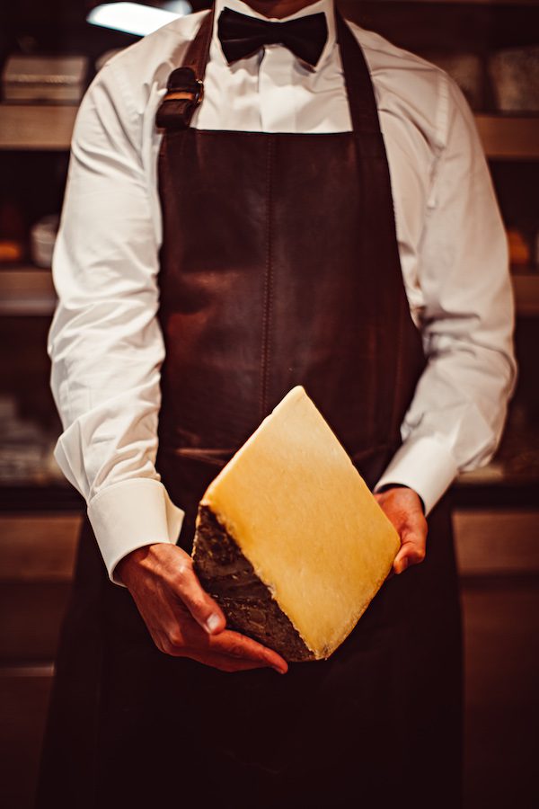 man holding cheese