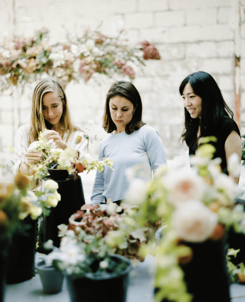 women arranging bouquets