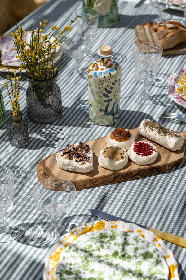 table set up for lunch outdoors with blue table cloth- Spring Tablescape