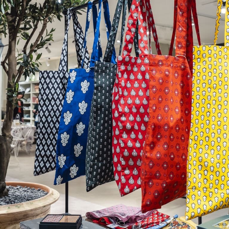 Colorful tote bags at the Souleiado showroom at the Bon Marché