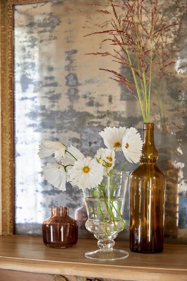 antique glass bottles styled with flowers