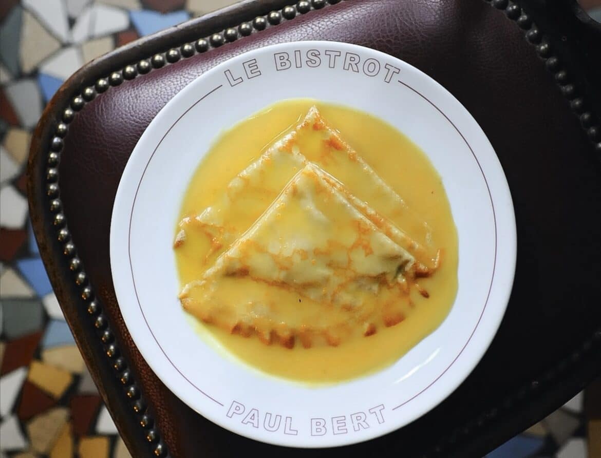Crepes Suzette on a bistrost plate at Paul Bert in Paris, Fance.