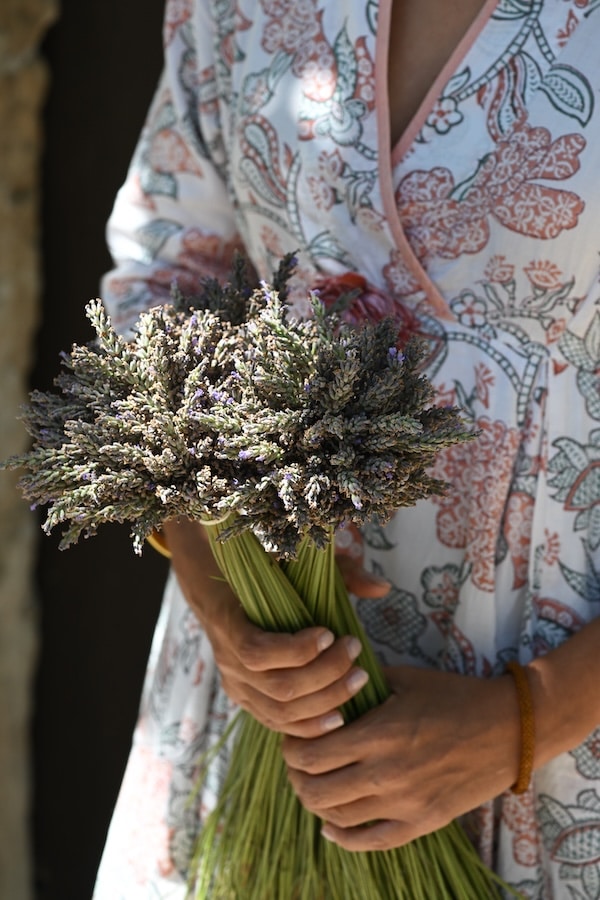 elsa lenthal holding a bouquet of lavender