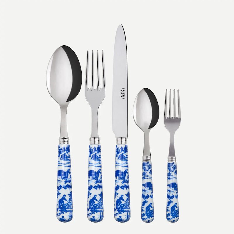 Sabre flatware with blue Toile de Jouy print handles.