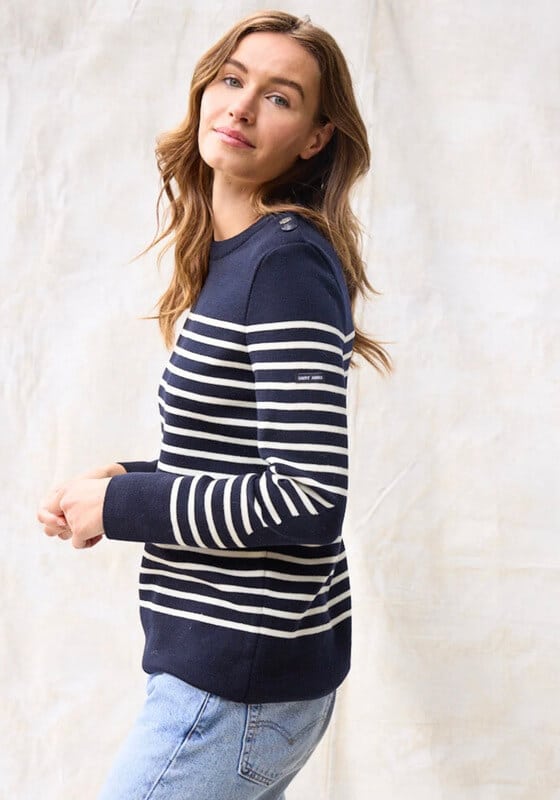 Navy blue and white striped French military sweater styled with blue Levi's jeans.