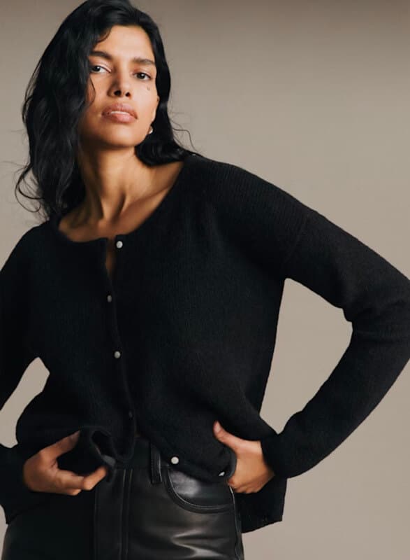 Sézane black Gaspard knit sweater styled with black leather pants.
