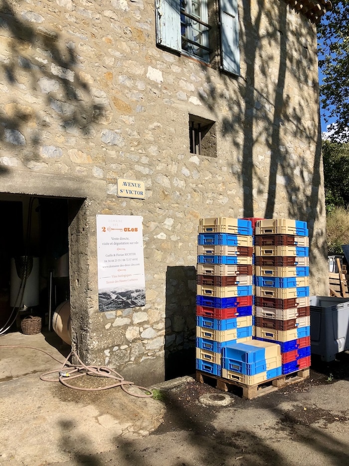 Stacked crates outside of a vineyard in Fontjoncouse, France.