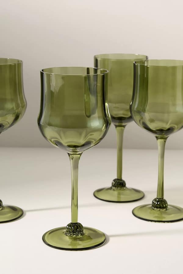 Green wine glasses with structural texture at the bottom of each stem.