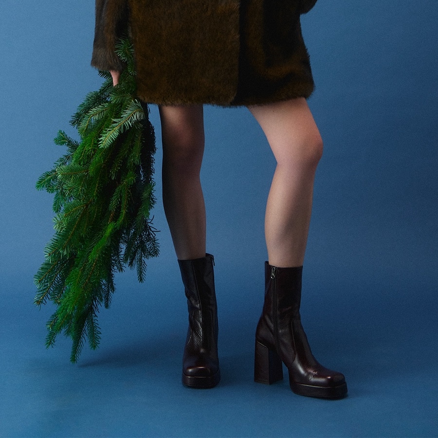 Jonak Ben boots in brown leather styled with a fur jacket.