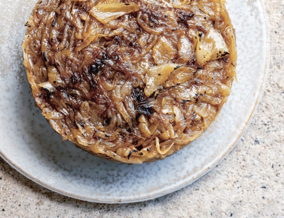 Alsatian Onion tart on a ceramic plate.