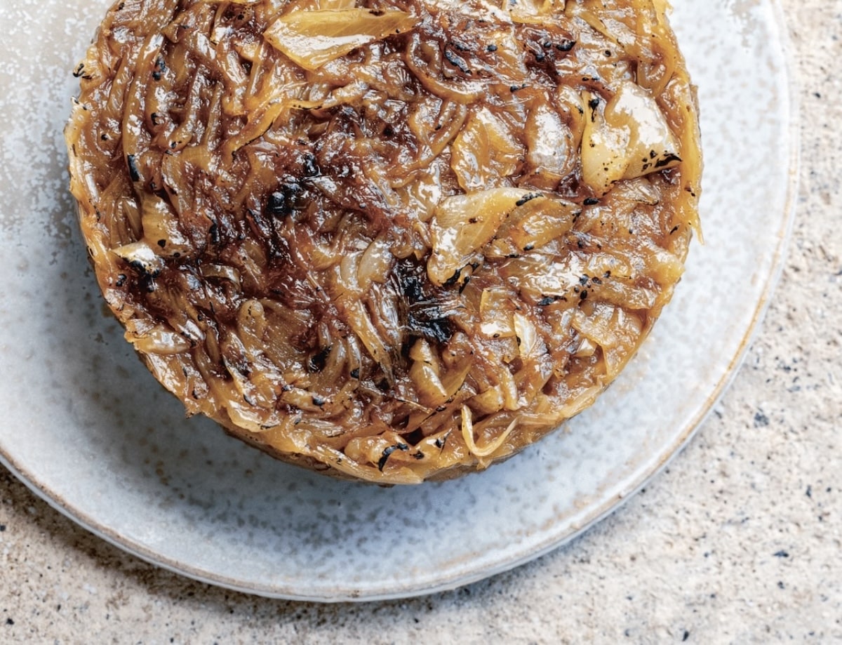 Alsatian Onion tart on a ceramic plate.